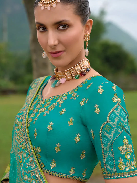 Turquoise Green Silk Lehenga with Heavily Embroidered Panels